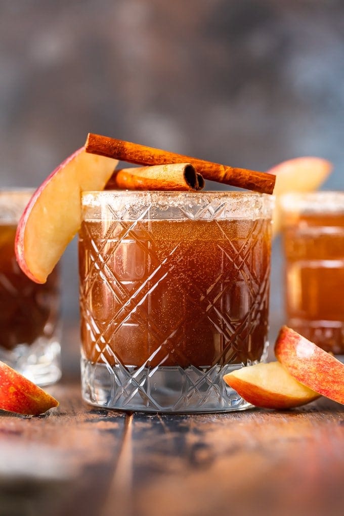 apple butter old fashioned in glass garnished with apple and cinnamon