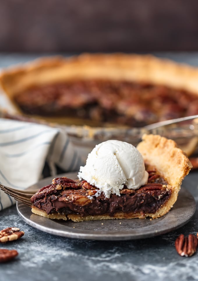 chocolate pecan pie topped with cream