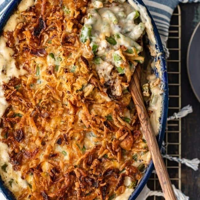 Classic Green Bean Casserole is one of those Thanksgiving recipes that you don't need to reinvent. It's absolutely perfect just the way it is, with green beans, cream of mushroom, crunchy fried onions, and some other awesome ingredients. This green bean casserole recipe is exactly what you need for you next holiday meal!