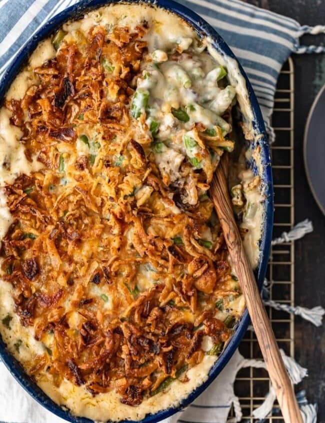 Classic Green Bean Casserole is one of those Thanksgiving recipes that you don't need to reinvent. It's absolutely perfect just the way it is, with green beans, cream of mushroom, crunchy fried onions, and some other awesome ingredients. This green bean casserole recipe is exactly what you need for you next holiday meal!
