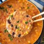 Creamy Chicken Tortilla Soup is one of my favorite fall soup recipes. It's creamy, it's delicious, and it's filled with all of my favorite Tex-Mex ingredients. This easy soup recipe is perfect for any night of the week, and it's so easy to save and reheat later!