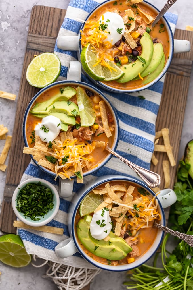 Three bowls of chicken tortilla soup viewed from above