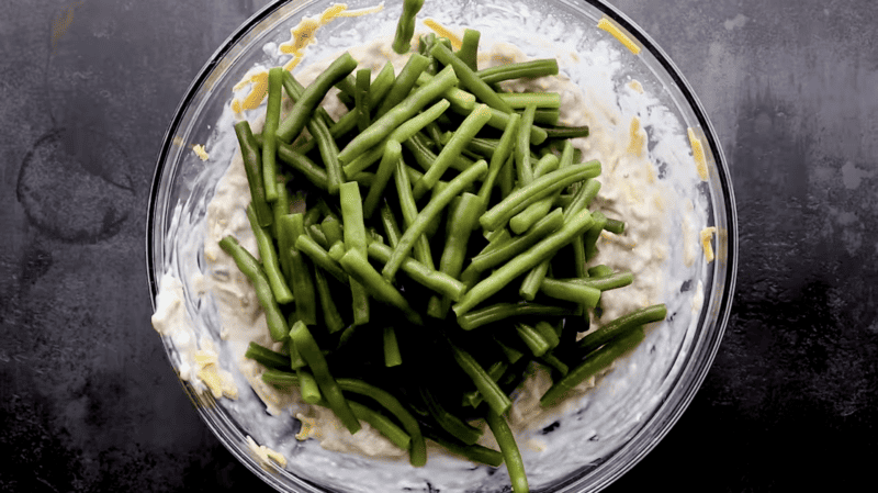 A bowl filled with green bean casserole.