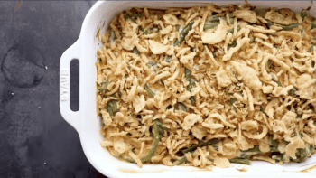 A green bean casserole dish with croutons.
