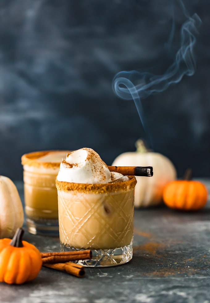 Pumpkin Spice White Russian Cocktail surrounded by mini pumpkins