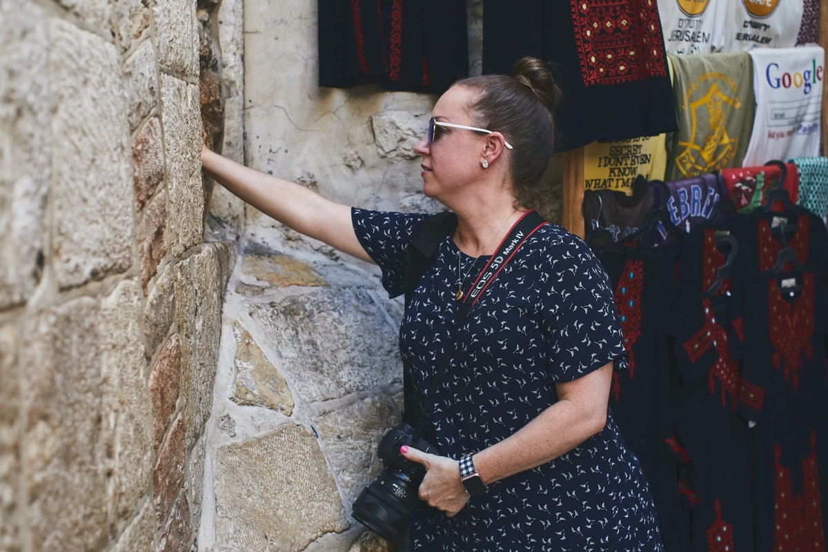 touching the wall at villa de la rosa in Jerusalem Israel