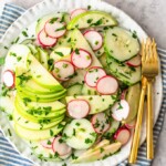 This Creamy Cucumber Salad is just the right mix of healthy veggies and delicious flavor. This easy cucumber salad recipe (cucumbers, radishes, and apples) features a tasty cucumber salad dressing made with mayo and apple cider vinegar. It's a fresh and simple salad perfect for any occasion!