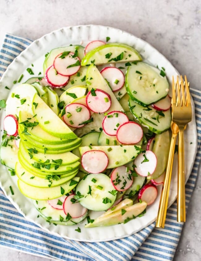This Creamy Cucumber Salad is just the right mix of healthy veggies and delicious flavor. This easy cucumber salad recipe (cucumbers, radishes, and apples) features a tasty cucumber salad dressing made with mayo and apple cider vinegar. It's a fresh and simple salad perfect for any occasion!