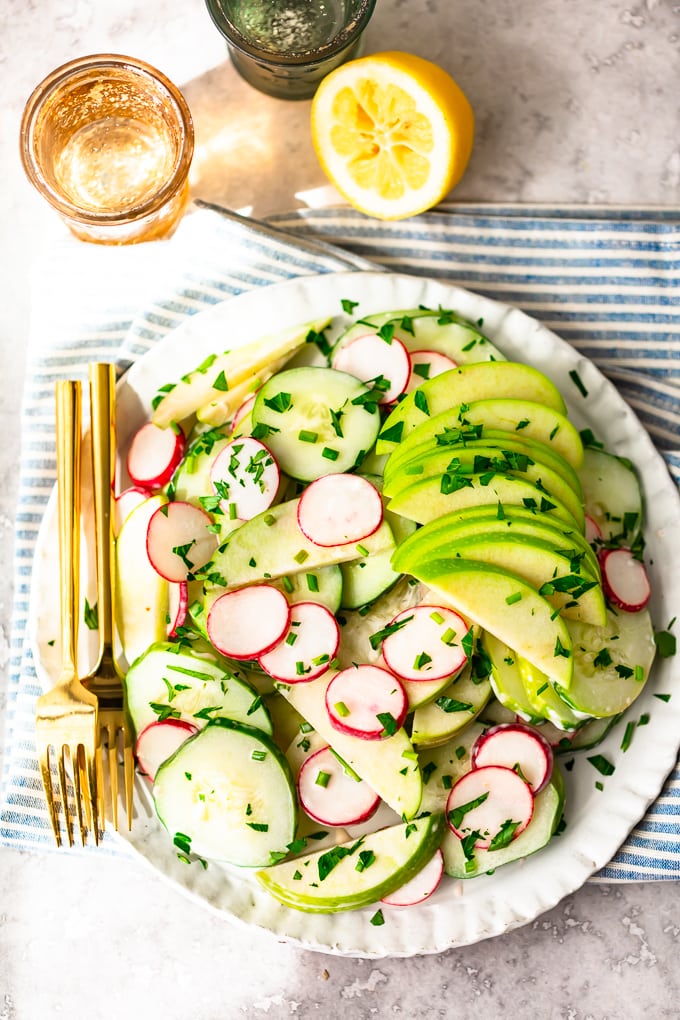 Easy Cucumber Salad: Sliced cucumbers, radishes, and apples with a mayo dressing