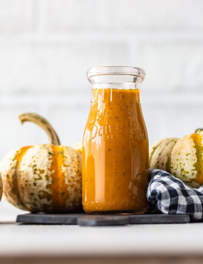 Maple Pumpkin Salad Dressing is the best autumn salad dressing recipe! Nothing says fall like pumpkin, and a bit of maple adds a rich flavor to it. This homemade salad dressing goes with all of your fall salad ideas, and it's the perfect kale salad dressing!