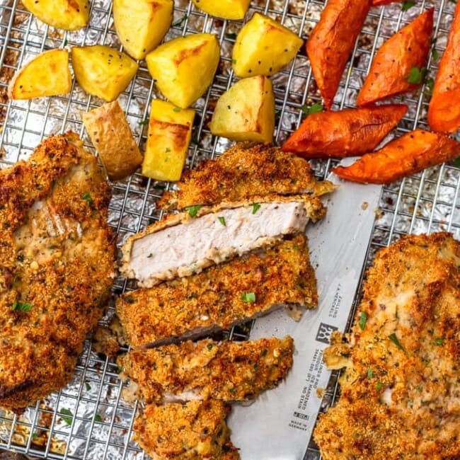 Breaded Pork Chops make an easy dinner for any night of the week. These breaded baked pork chops are crispy, flavorful, and beyond simple. Make your breadcrumbs, throw the pork chops in the oven, add some roasted veggies, and you've got one easy pork chop recipe made on a single sheet pan!