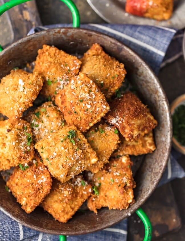 Toasted Ravioli is a classic St. Louis appetizer that deserves worldwide recognition. These deep fried raviolis are crispy, flavorful, and absolutely addicting! This easy fried ravioli recipe is perfect for parties, pre-dinner apps. or pretty much any occasion. Just dip them in marinara sauce and enjoy!