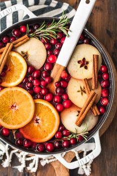 Spiced Cider is a holiday must! Warm things up this season with this delicious Cranberry Apple Hot Cider Recipe. It's easy, it's festive, and it's the perfect drink to serve for any Christmas party. Make it without alcohol for the whole family, or make it spiked hot apple cider for the adults. Either way, the flavor is just perfect!
