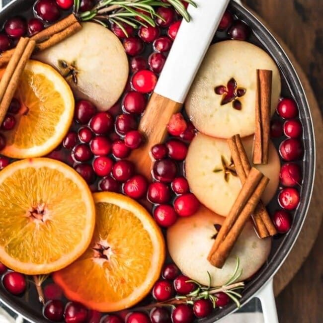 Spiced Cider is a holiday must! Warm things up this season with this delicious Cranberry Apple Hot Cider Recipe. It's easy, it's festive, and it's the perfect drink to serve for any Christmas party. Make it without alcohol for the whole family, or make it spiked hot apple cider for the adults. Either way, the flavor is just perfect!