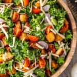 Kale Caesar Salad is the perfect side salad for any meal! It's just like a classic caesar salad, but with a twist. You've got the homemade croutons and the caesar dressing, but we're throwing in kale instead of romaine, and adding some tomatoes and shallots for extra flavor. This salad recipe is good!