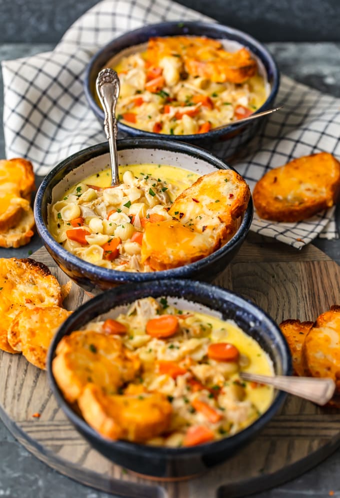 Chicken mac and cheese soup topped with cheesy toasted crostini