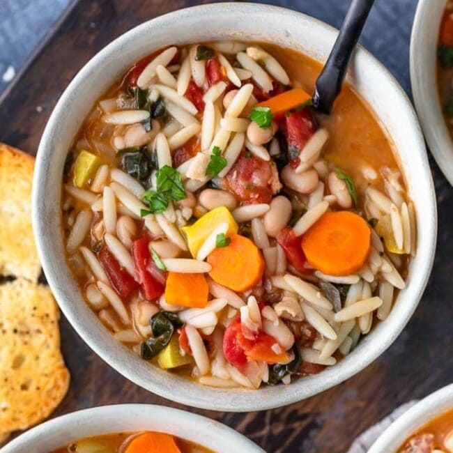 Minestrone Soup is the perfect soup for winter! It's hearty, delicious, and so easy to make. This is the best minestrone soup recipe, made with Orzo and crispy Pancetta. Yum!