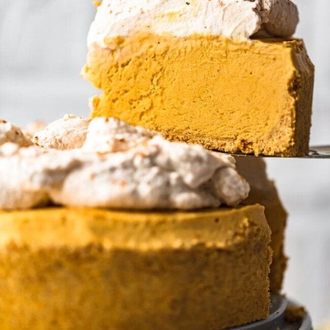 Pumpkin Pie Cheesecake is the perfect fall dessert, made with a graham cracker crust and topped off with pumpkin spice whipped cream. This no bake pumpkin cheesecake recipe is so easy to make. You definitely want this at your holiday feast!