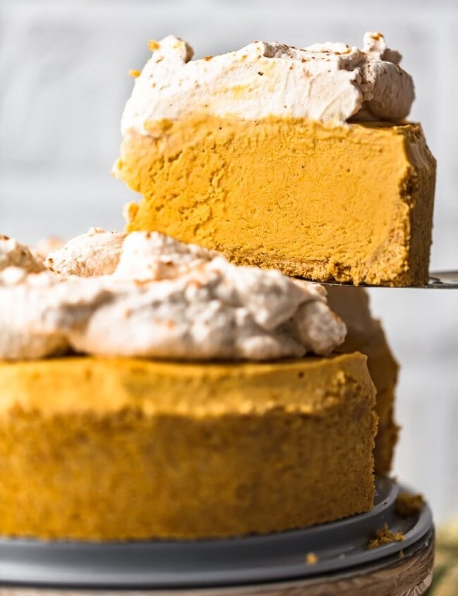 Pumpkin Pie Cheesecake is the perfect fall dessert, made with a graham cracker crust and topped off with pumpkin spice whipped cream. This no bake pumpkin cheesecake recipe is so easy to make. You definitely want this at your holiday feast!