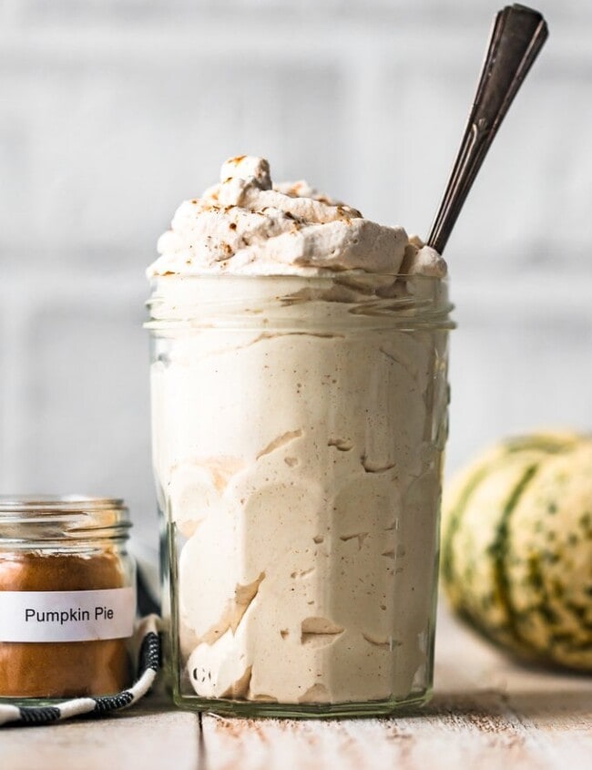 Pumpkin Flavored Whipped Cream is exactly what we all need for fall! Top of all of your favorite desserts (pumpkin pie, pumpkin cheesecake, pumpkin anything) with this Pumpkin Spice Whipped Cream recipe.
