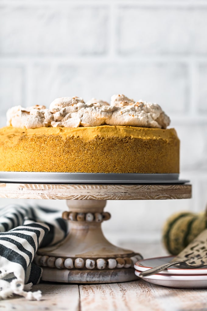 No Bake Pumpkin Cheesecake on a cake stand