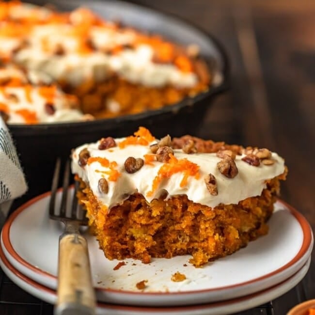Skillet Carrot Cake is the perfect way to make this delicious dessert without an oven. This easy carrot cake recipe with pineapple is so moist, so flavorful, and so simple! And we're topping it off with the absolute best cream cheese frosting for carrot cake, because it wouldn't be complete without it!