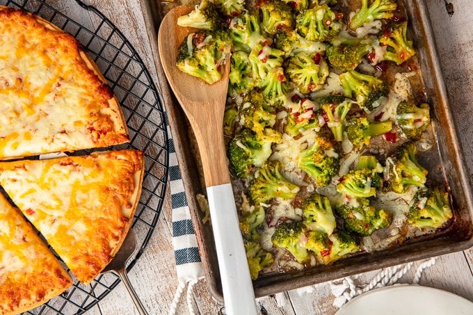 This Spicy Cheesy Broccoli Recipe is the perfect easy side dish for those busy nights. When you're rushing around and on the go, you still need to eat your vegetables and create a balanced meal! Kids and adults alike will love this Firecracker Broccoli with Cheese paired with Tombstone Pizza Cheesy Broccoli is a side dish the entire family will ask for again and again.
