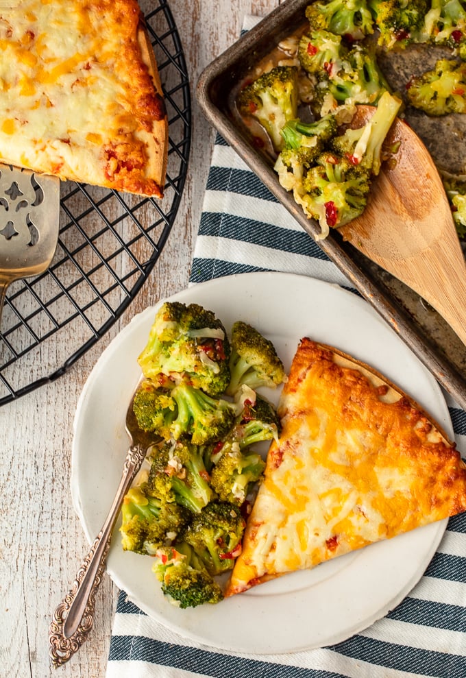 This Spicy Cheesy Broccoli Recipe is the perfect easy side dish for those busy nights. When you're rushing around and on the go, you still need to eat your vegetables and create a balanced meal! Kids and adults alike will love this Firecracker Broccoli with Cheese paired with Tombstone Pizza Cheesy Broccoli is a side dish the entire family will ask for again and again.