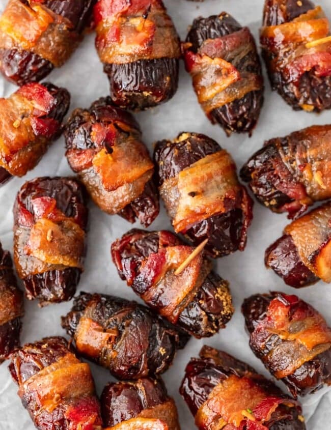 This Bacon Wrapped Dates recipe is one tasty appetizer! Everyone loves a good bacon wrapped recipe, and these bacon wrapped dates with goat cheese and pecans are out of this world. They're perfect for game day and New Year's Eve!