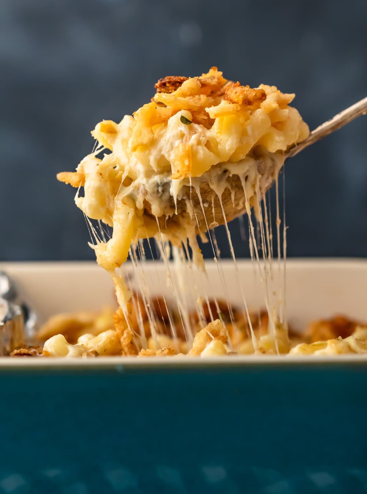 up close shot of cheese pull on baked mac and cheese casserole