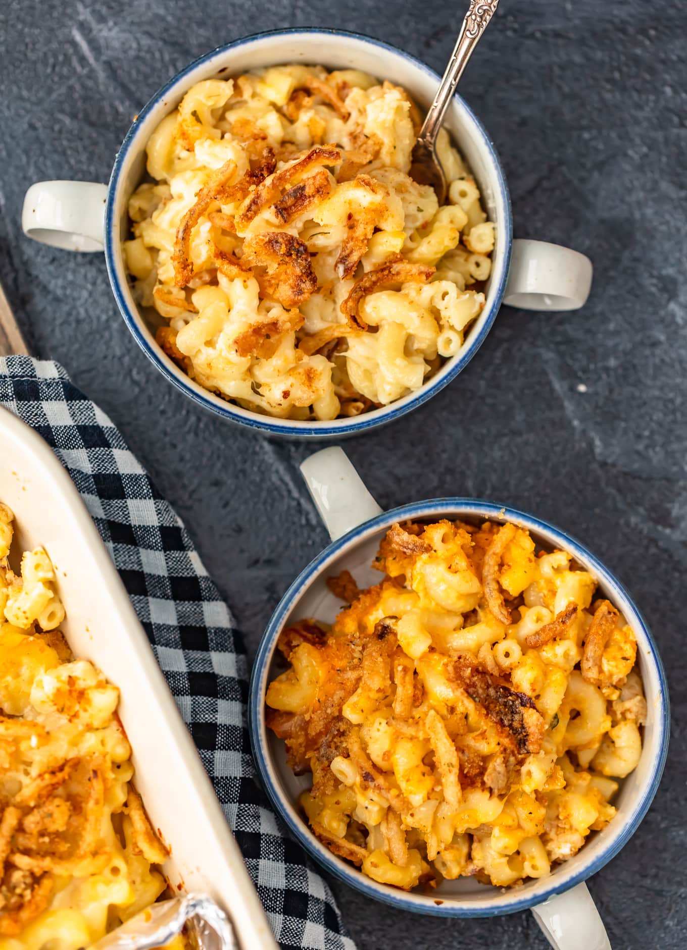 shot of two bowls of baked macaroni and cheese casserole