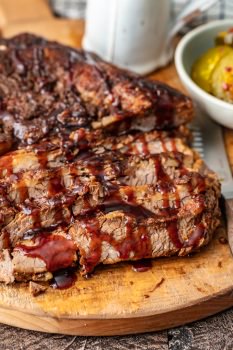 This Beef Brisket recipe is perfect any time of year. You can make BBQ brisket in the oven for a super tender, delicious result. This oven baked brisket is made even better with my special BBQ brisket sauce!