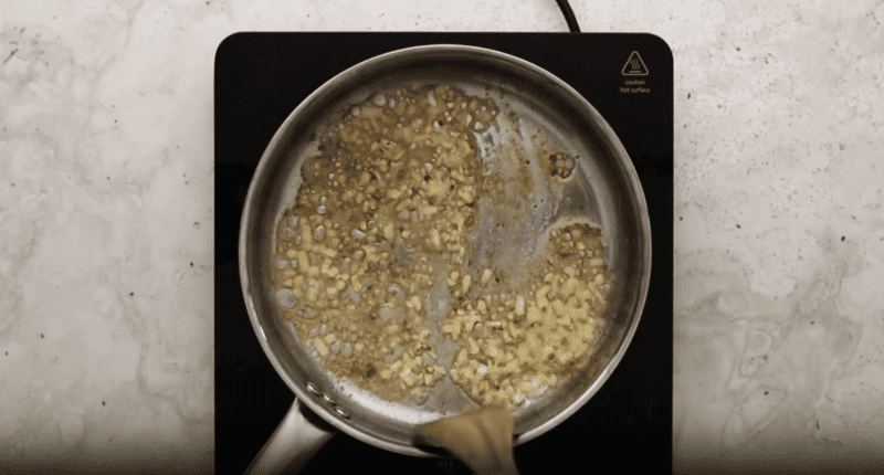 A frying pan with broccoli and cauliflower gratin.