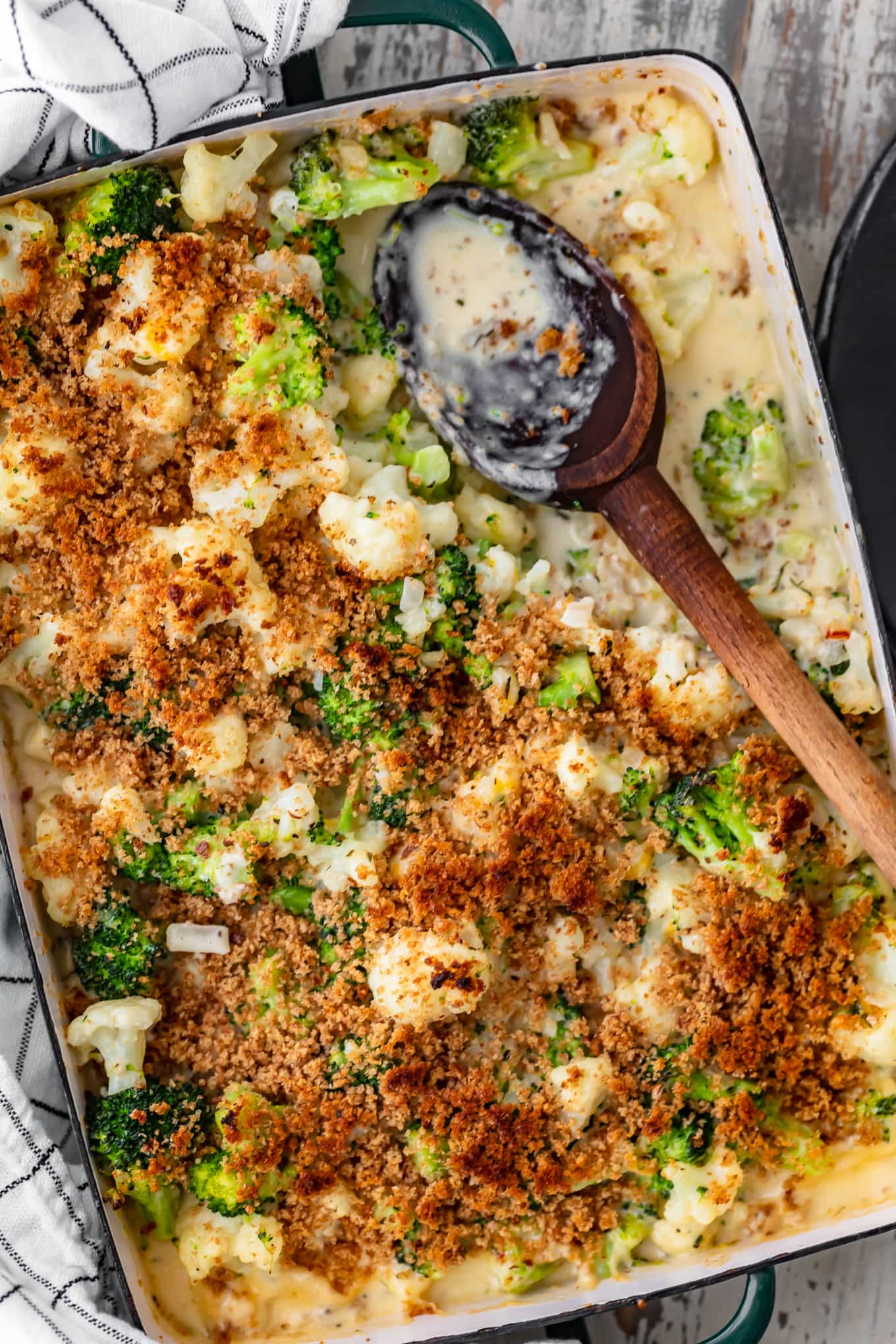 casserole dish filled with cauliflower and broccoli with a bread crumb topping