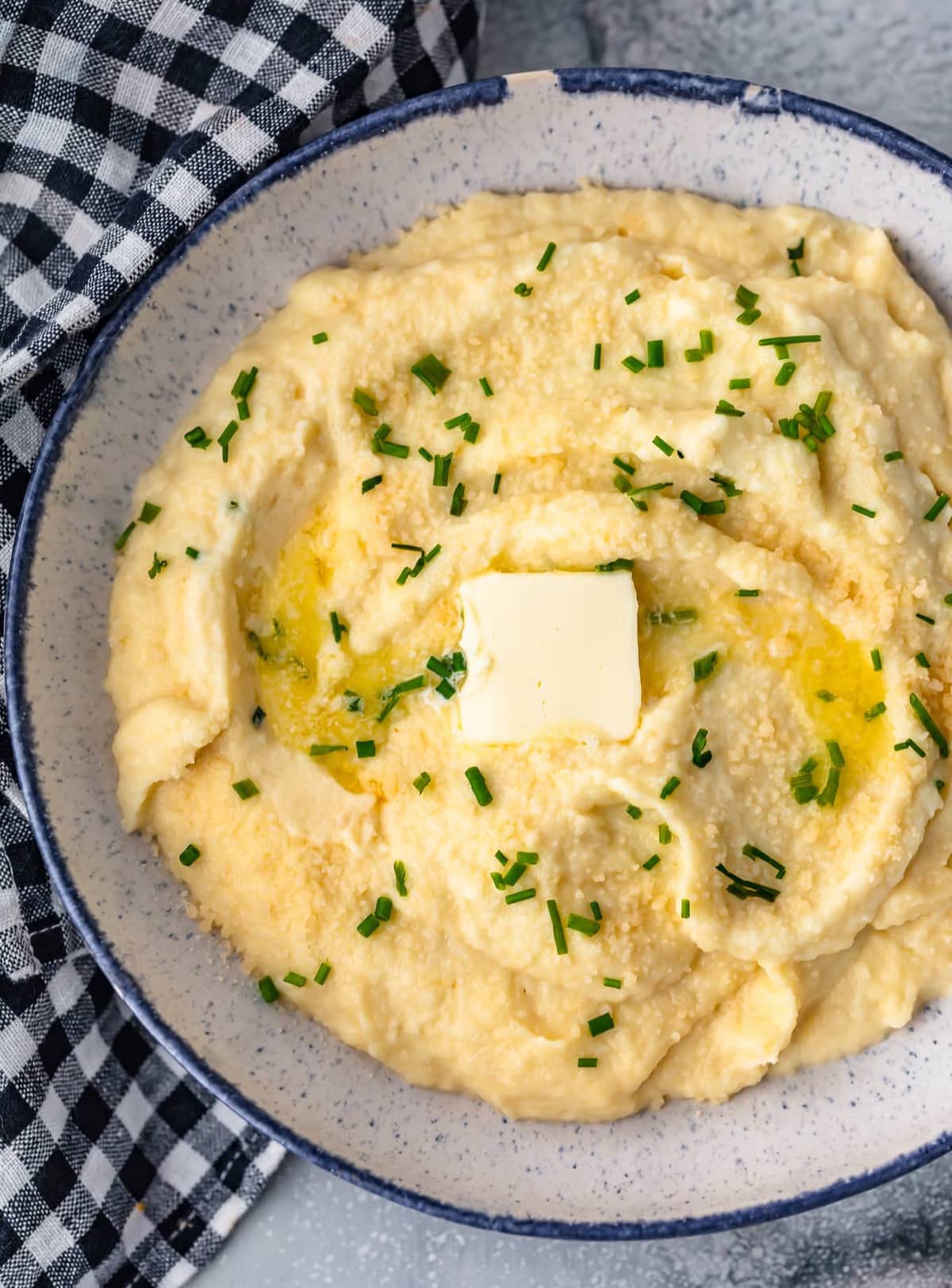 cheesy mashed cauliflower in a large bowl