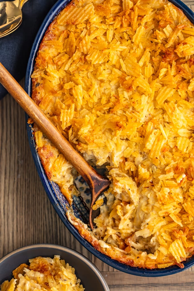 cheesy hash brown potato casserole in a blue dish