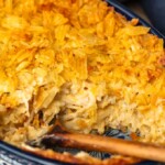 Cheesy Potato Casserole is the ideal holiday side dish recipe for anyone that loves cheese and potatoes. This hash brown potato casserole recipe is super easy, super cheesy, and topped off with a crunchy potato chip topping!