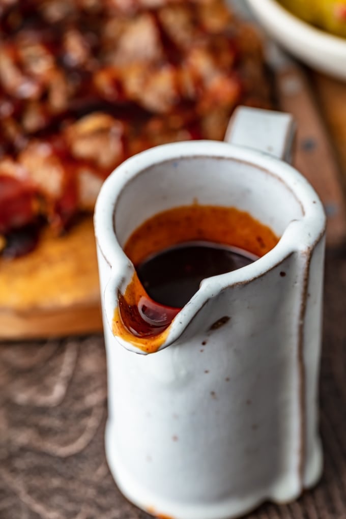 small ceramic container filled with brisket sauce