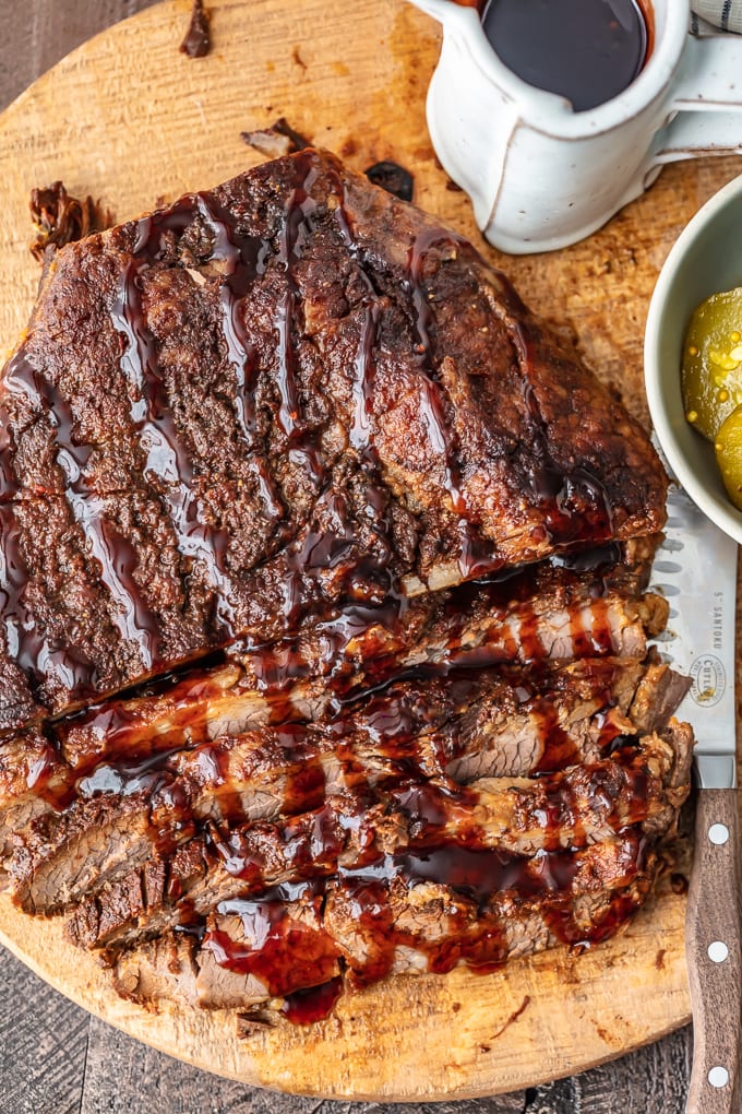 overhead view of a piece of beef brisket, covered with homemade BBQ sauce