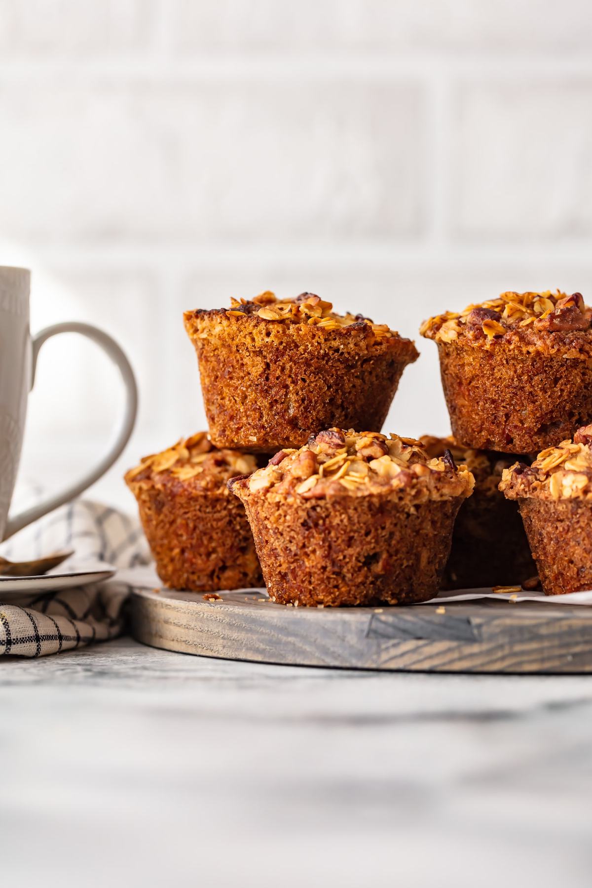 morning glory muffins stacked on a serving board