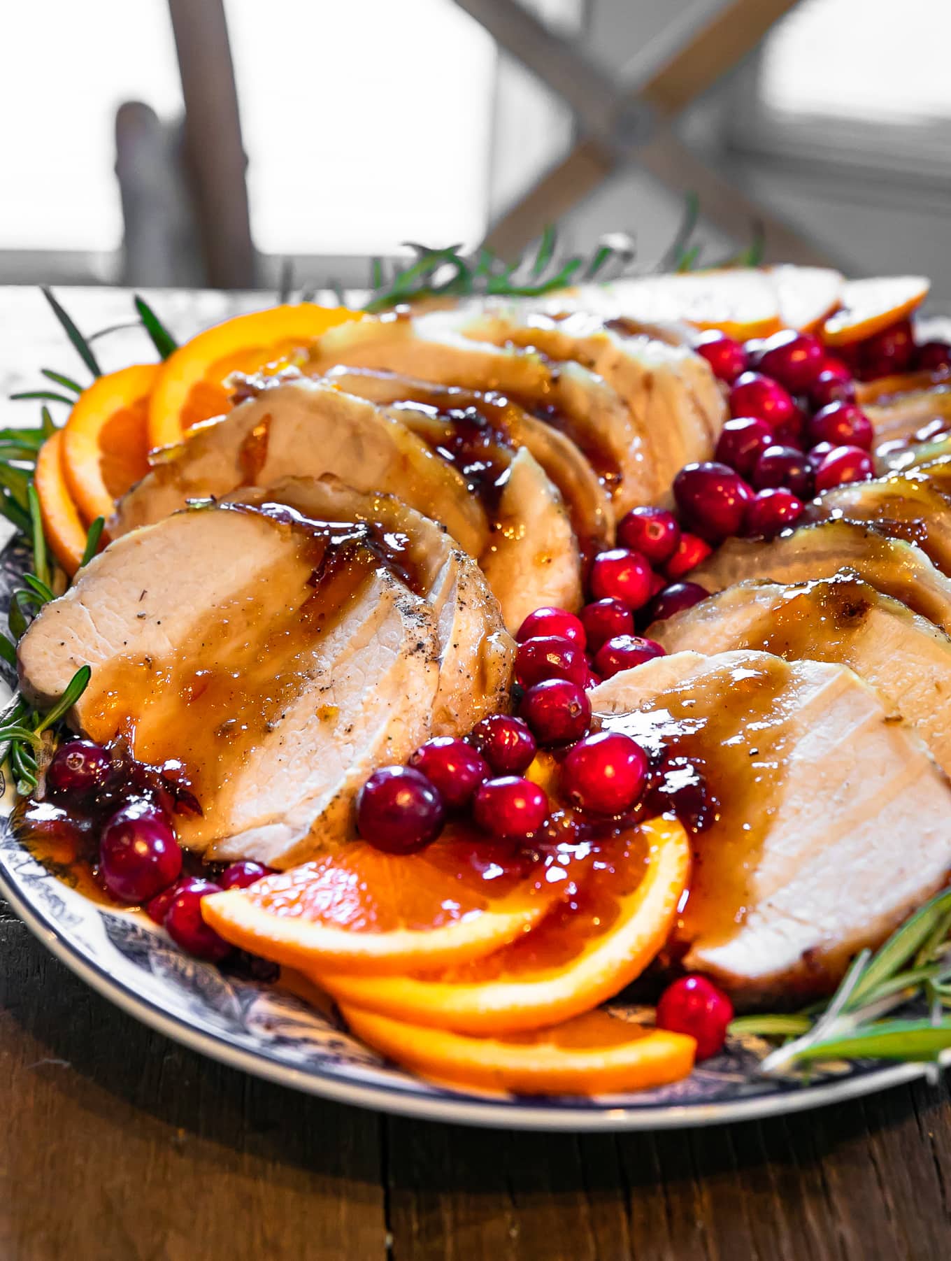 pork loin roast covered in cranberries and orange