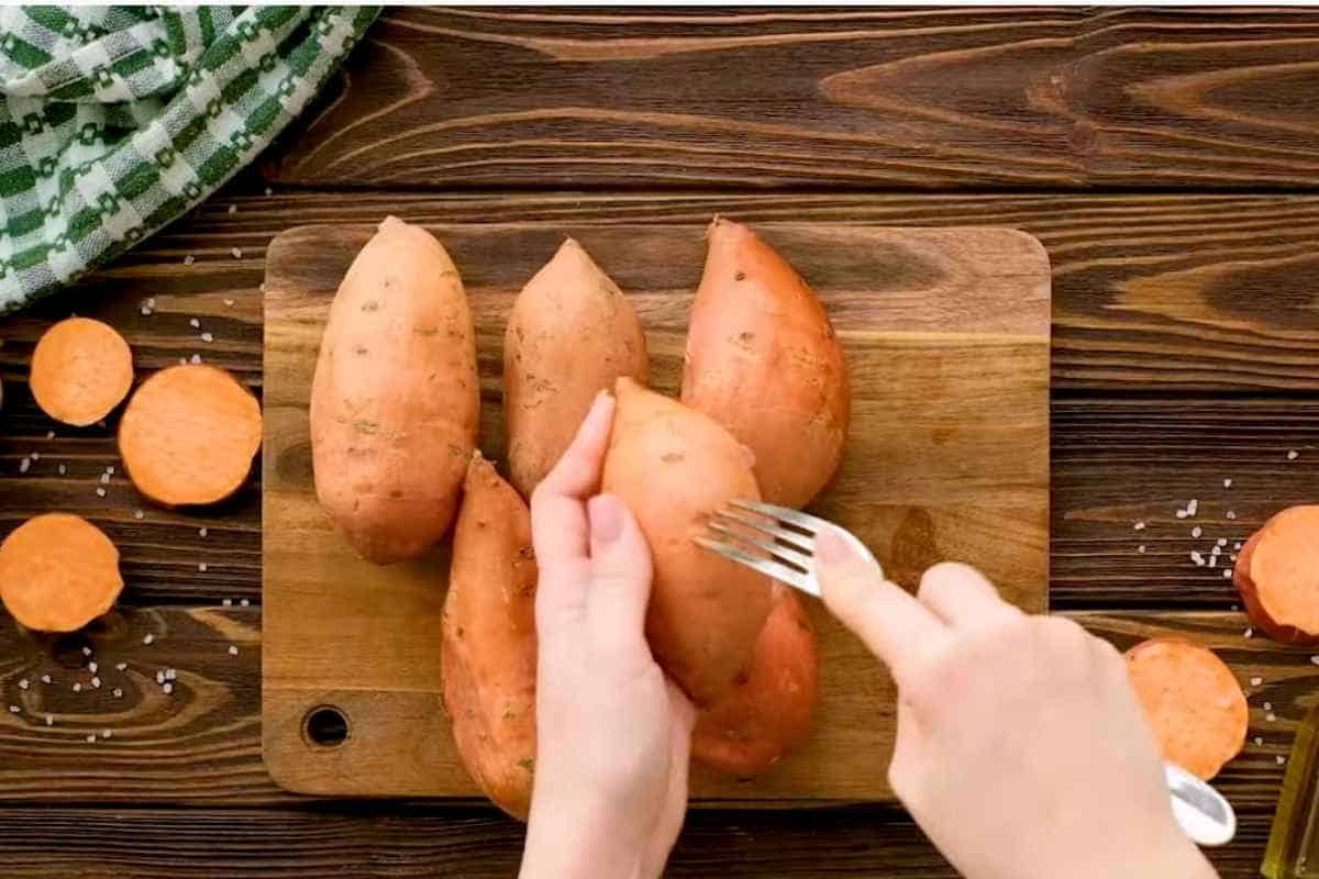 poking sweet potatoes with fork