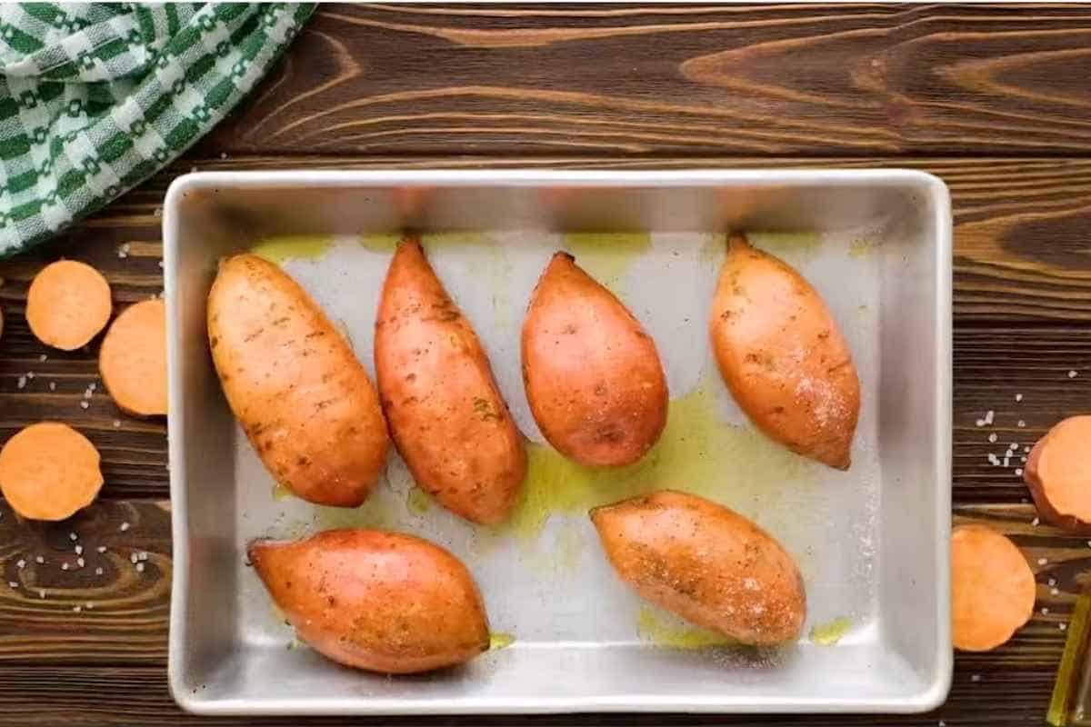 sweet potatoes in baking sheet, sprinkle some salt before baking