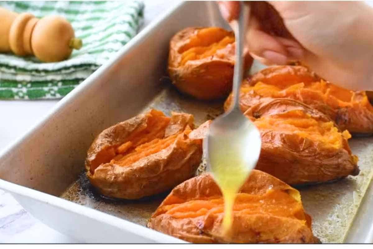 dripping some melted butter in baked sweet potatoes