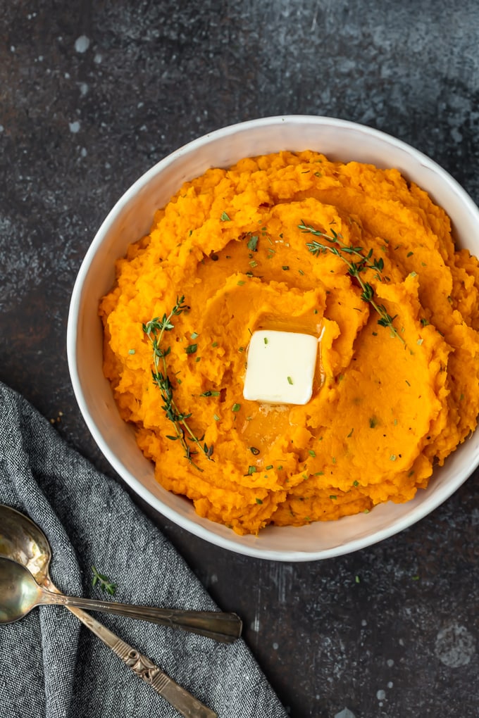 overhead view of easy mashed sweet potatoes in a white serving bowl