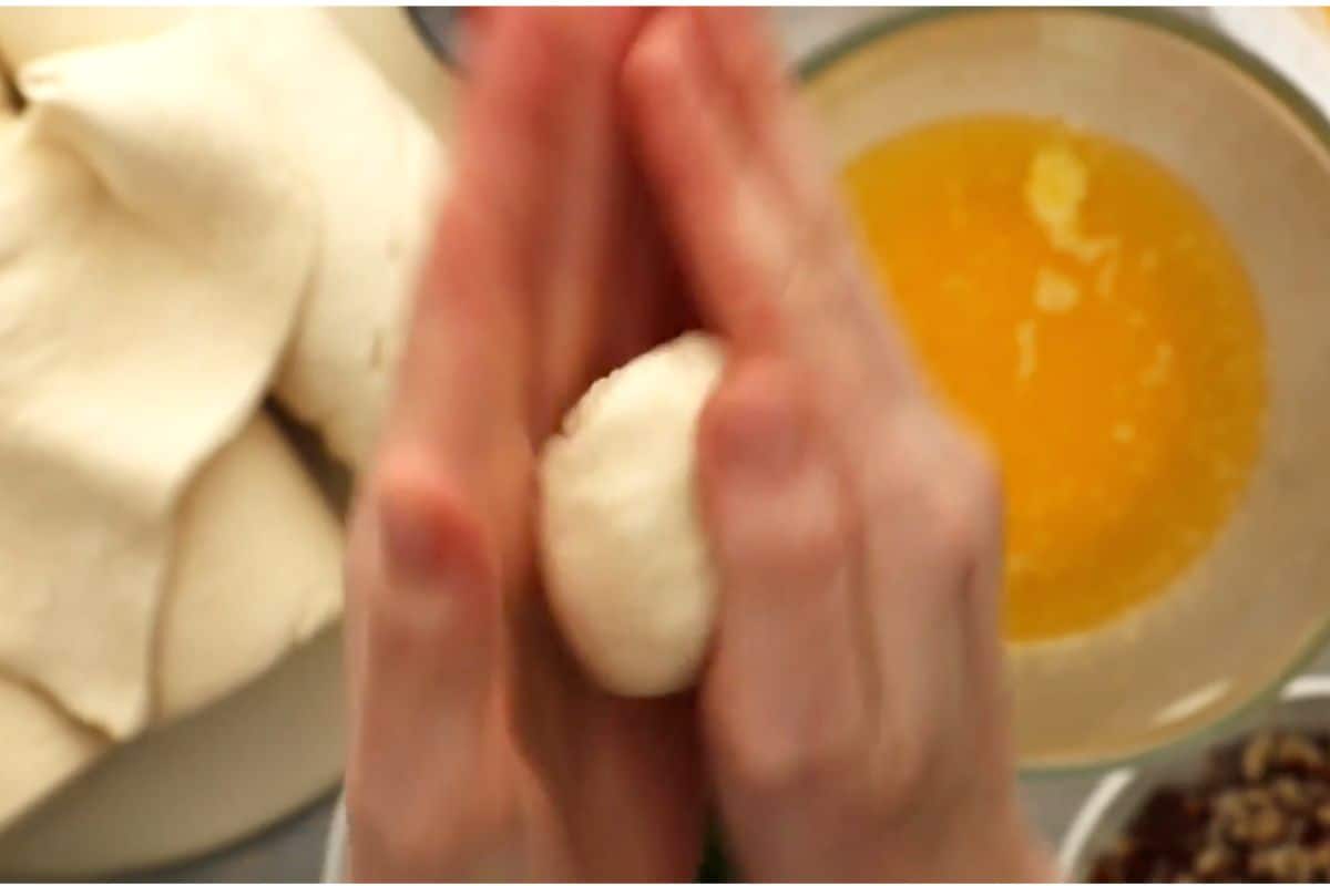 gently forming a ball with the help of both palms.
