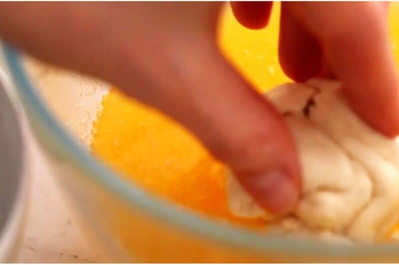 gently formed dough ball rolled in melted butter
