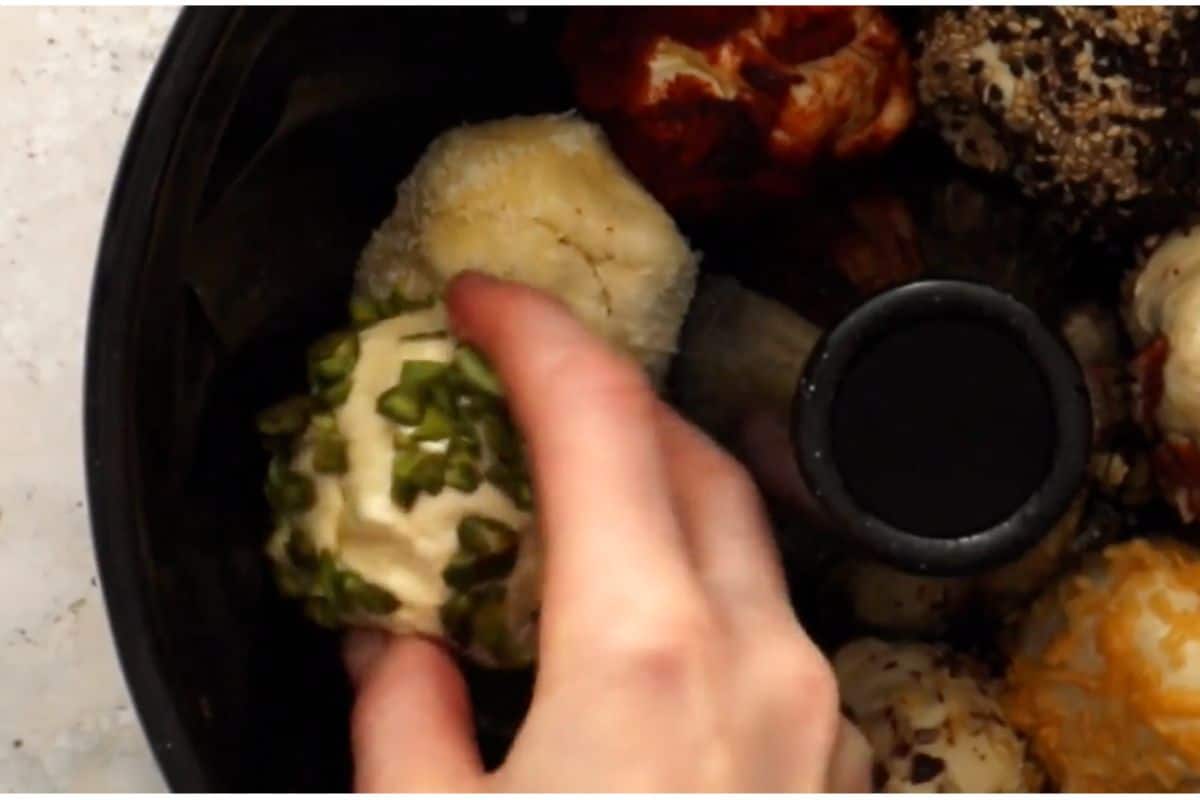 rolling in favorite toppings and placing in bundt pan