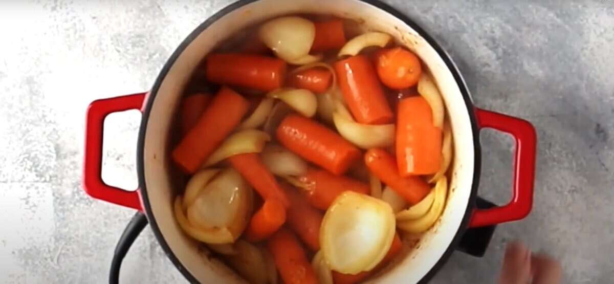 Caramelizing the vegetables in the pot. 