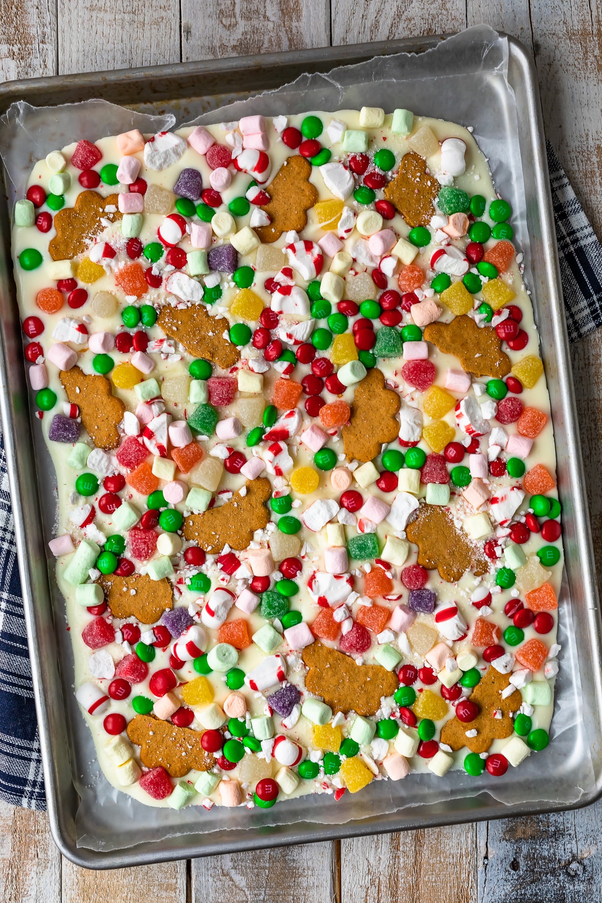christmas white chocolate gingerbread house bark on a cookie sheet